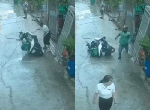 Cán bộ phường ở TP HCM bị kiểm điểm vì xô ngã xe shipper. (Ảnh cắt từ camera an ninh)